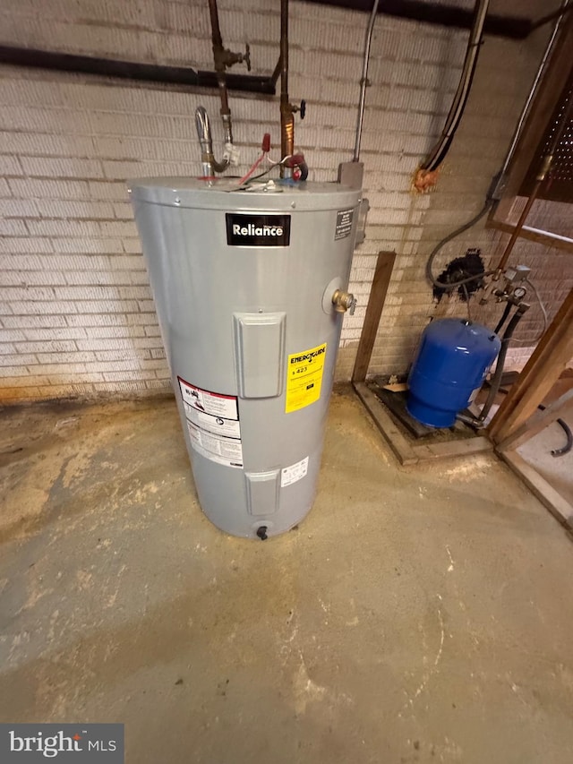 utility room with electric water heater