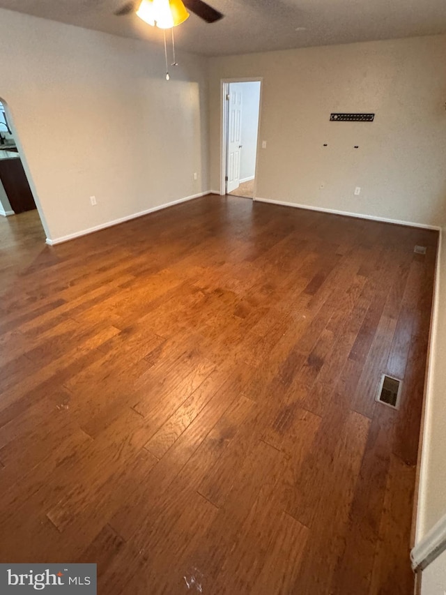 unfurnished room featuring ceiling fan and hardwood / wood-style floors