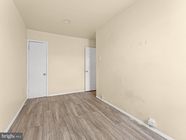 unfurnished room featuring light hardwood / wood-style flooring