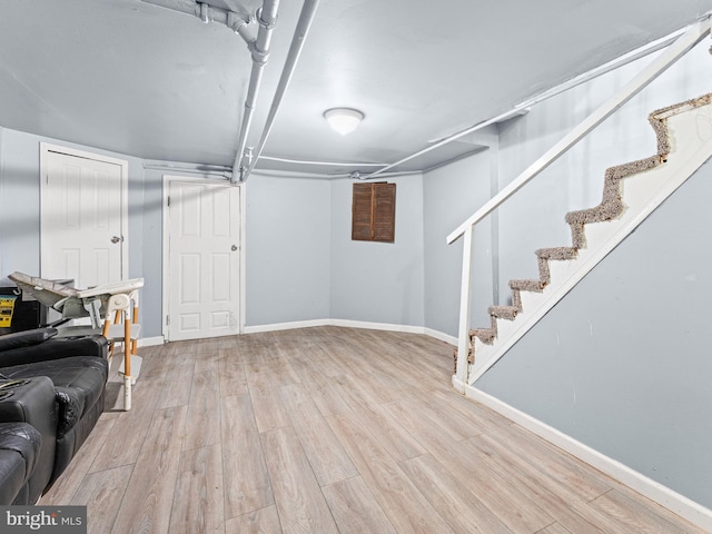 basement featuring light hardwood / wood-style floors