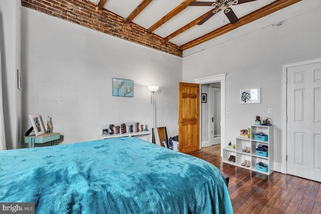 bedroom with ceiling fan, beam ceiling, and hardwood / wood-style flooring