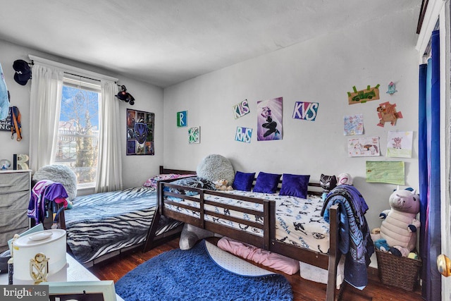 bedroom featuring wood finished floors