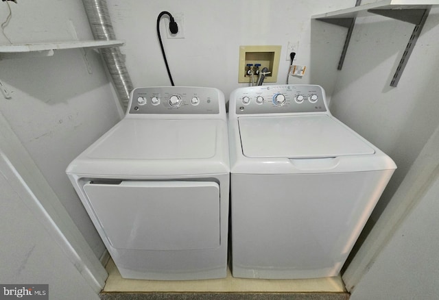 washroom featuring independent washer and dryer