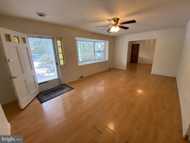 entryway featuring ceiling fan, light hardwood / wood-style flooring, and a wealth of natural light