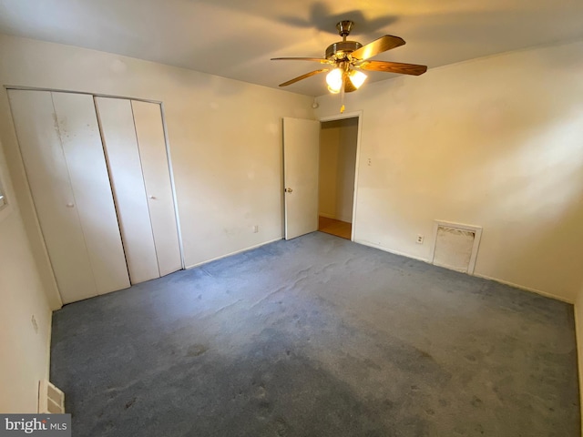 unfurnished bedroom with ceiling fan and carpet flooring