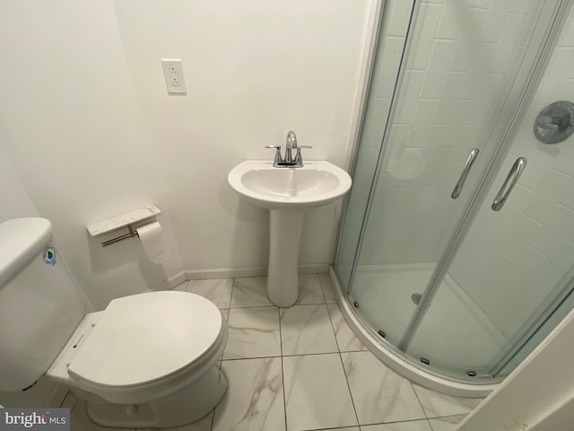 bathroom with walk in shower and toilet