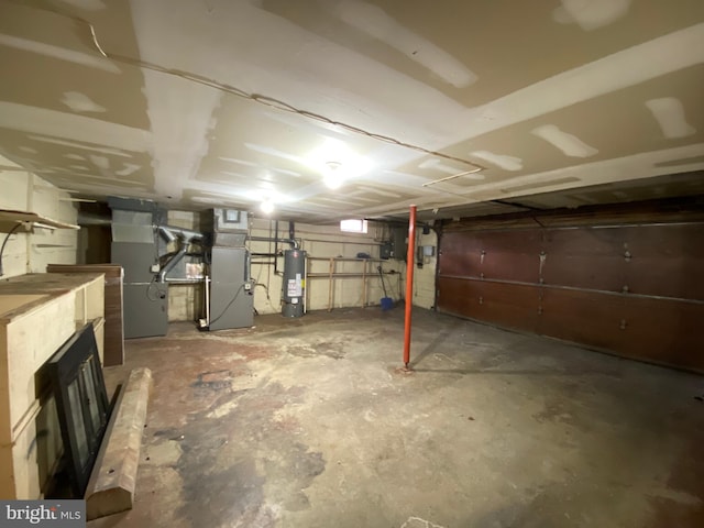 basement featuring water heater and heating unit