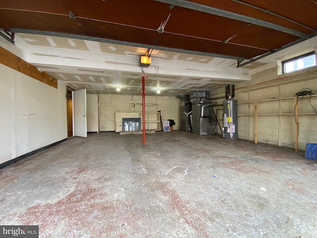 garage featuring a garage door opener, heating unit, and gas water heater