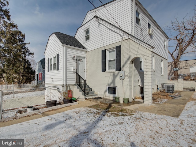 view of front of home with cooling unit