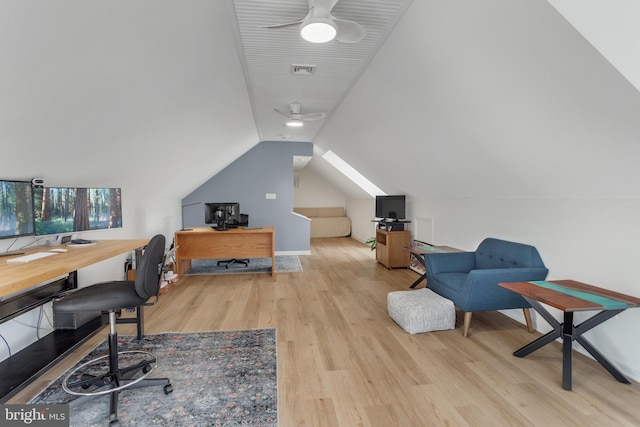 home office with ceiling fan, vaulted ceiling, and light wood-type flooring