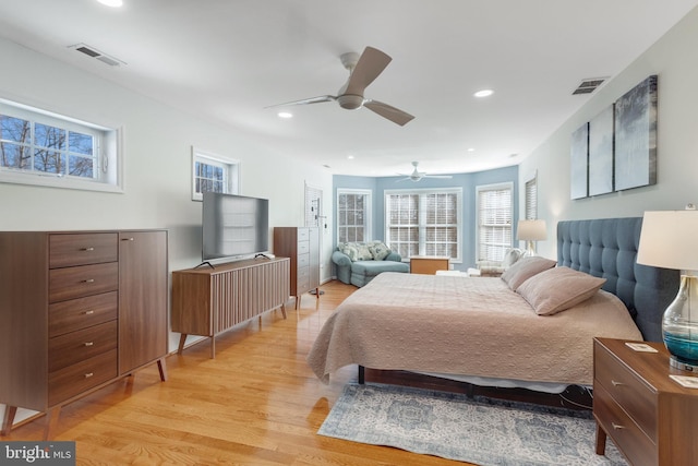 bedroom featuring ceiling fan and light hardwood / wood-style floors