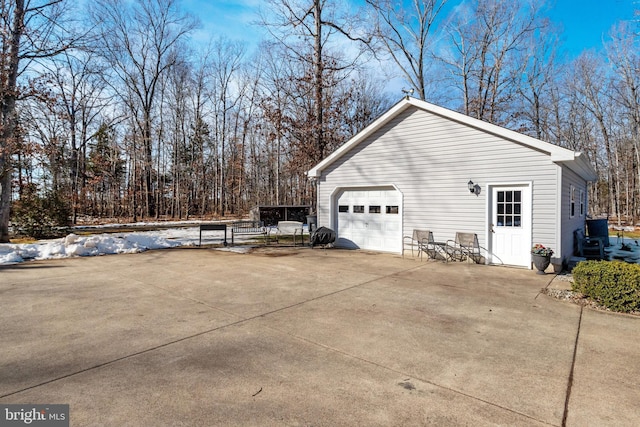 view of home's exterior with an outbuilding and a garage