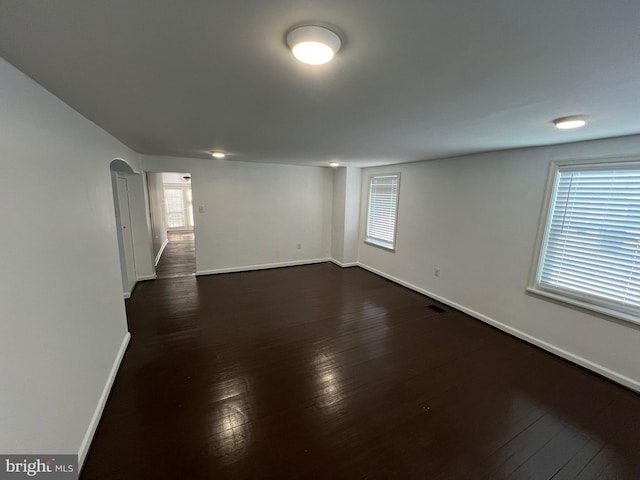 empty room featuring dark wood-type flooring