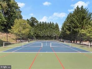 view of tennis court featuring basketball court