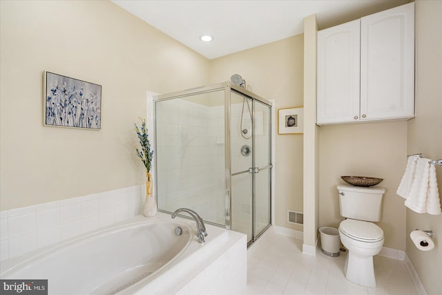 bathroom with tile patterned floors, toilet, and plus walk in shower