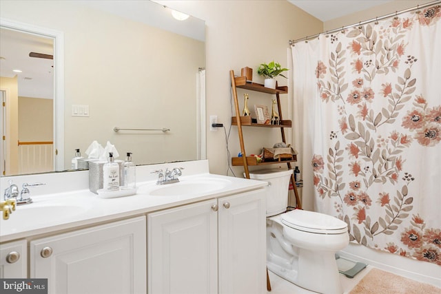 full bathroom featuring vanity, toilet, and shower / bath combo with shower curtain