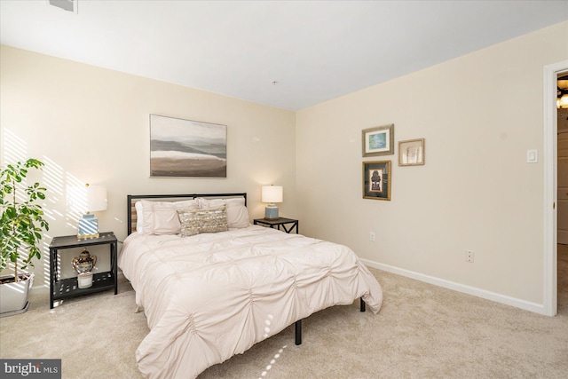 bedroom with light carpet