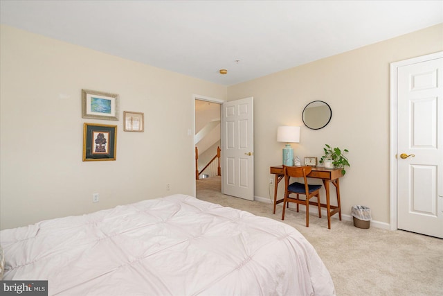 bedroom featuring light carpet