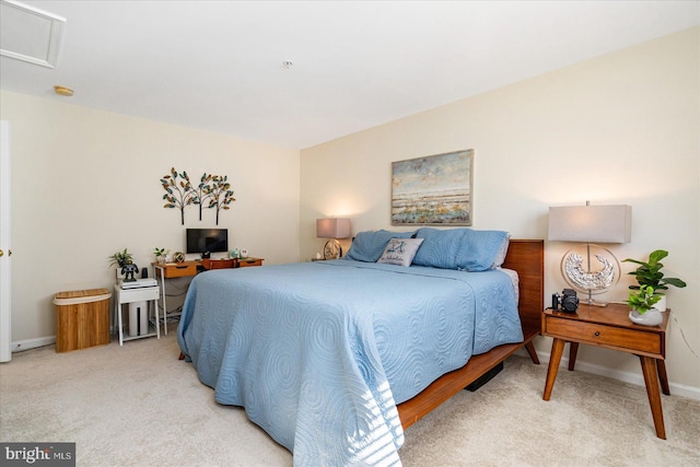 bedroom featuring light colored carpet