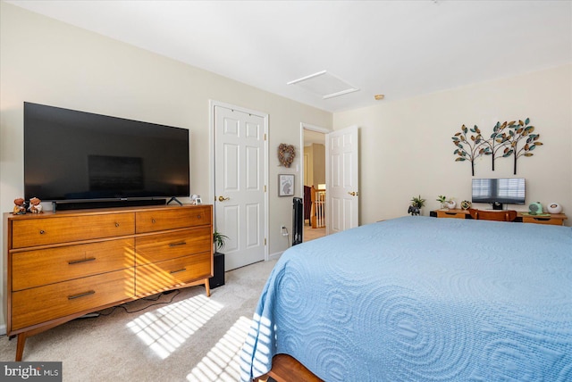 bedroom featuring light colored carpet