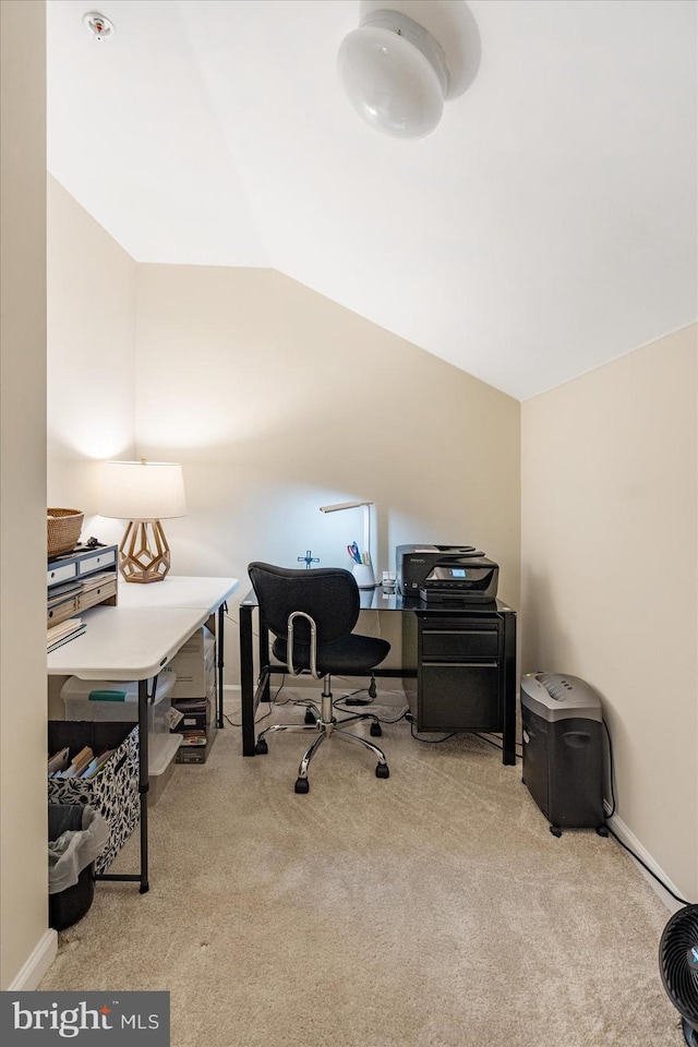 office featuring light carpet and lofted ceiling