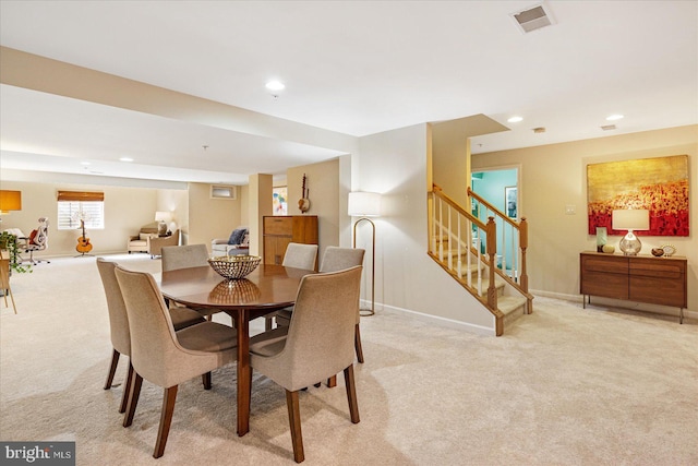 view of carpeted dining area