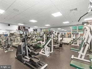 exercise room with a drop ceiling