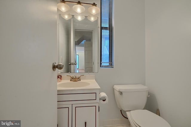 bathroom featuring toilet and vanity