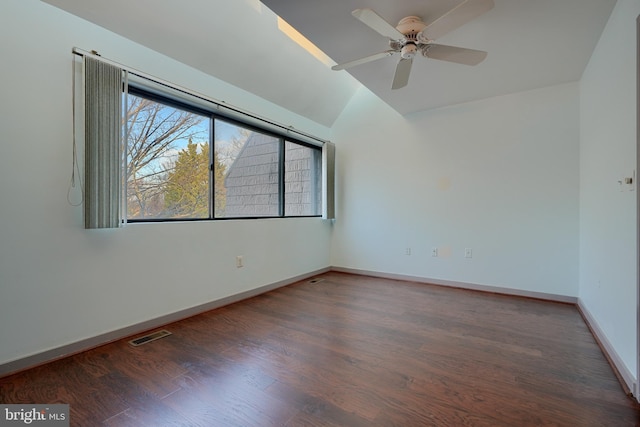 unfurnished room featuring ceiling fan, dark hardwood / wood-style floors, and lofted ceiling