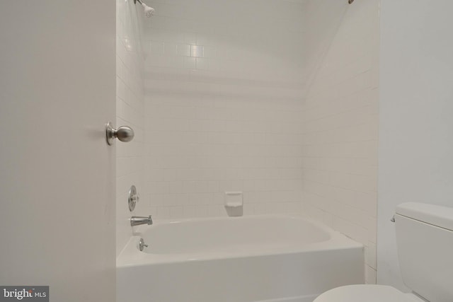 bathroom featuring toilet and bathtub / shower combination