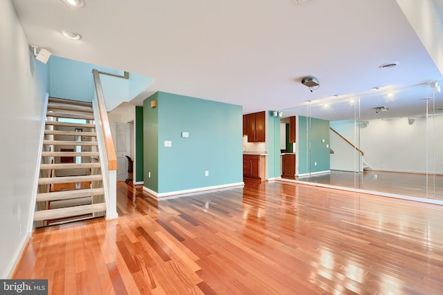 unfurnished living room featuring light wood-type flooring