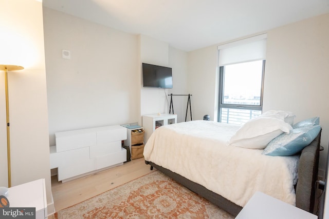 bedroom with hardwood / wood-style flooring