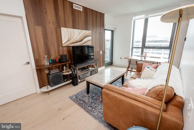 living room with light hardwood / wood-style floors