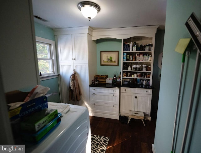 laundry room featuring dark hardwood / wood-style floors