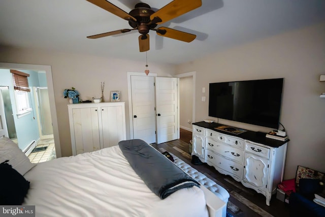 bedroom with ceiling fan, ensuite bathroom, and dark hardwood / wood-style floors