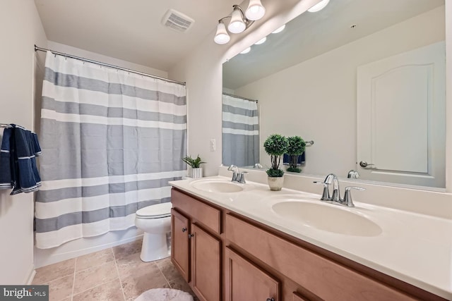 full bathroom featuring toilet, vanity, and shower / tub combo with curtain