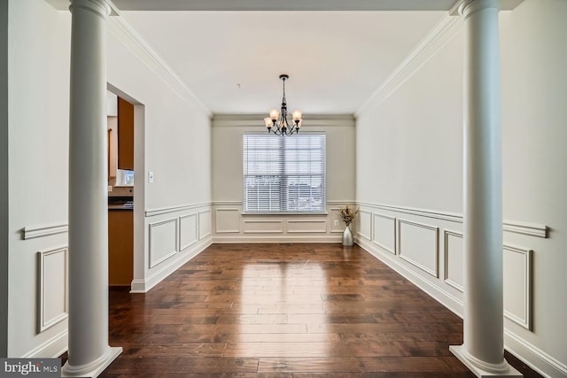 unfurnished dining area with dark wood-type flooring, a notable chandelier, and ornamental molding