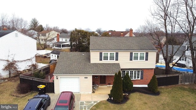 view of front facade with a garage and a front yard