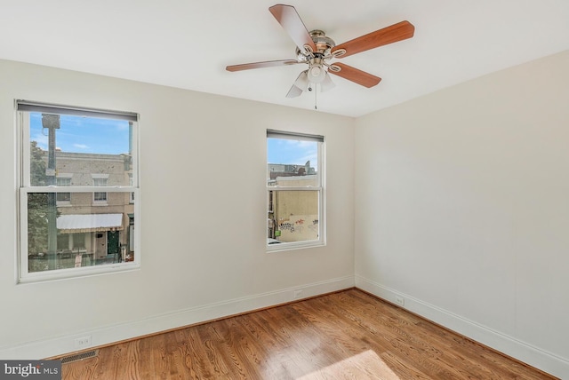 unfurnished room with ceiling fan and light hardwood / wood-style flooring