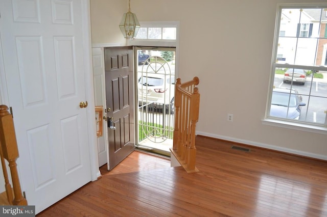 foyer featuring a healthy amount of sunlight and light hardwood / wood-style floors