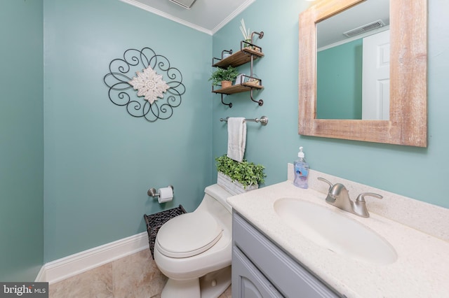 bathroom with tile patterned floors, vanity, toilet, and ornamental molding