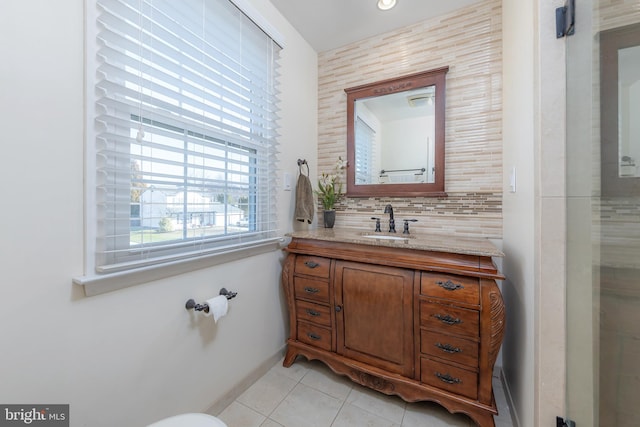 bathroom featuring vanity, tasteful backsplash, and tile patterned floors