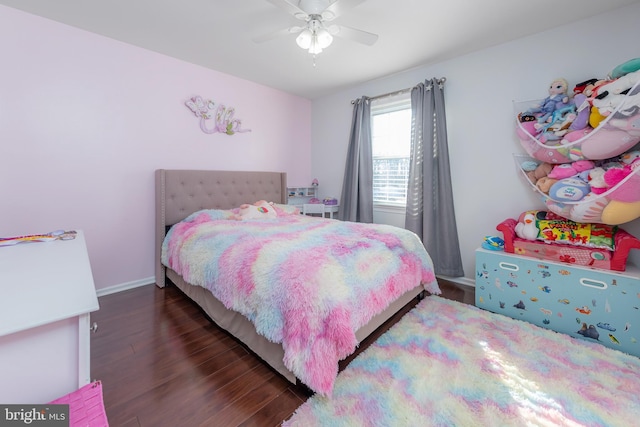 bedroom with ceiling fan and dark hardwood / wood-style floors