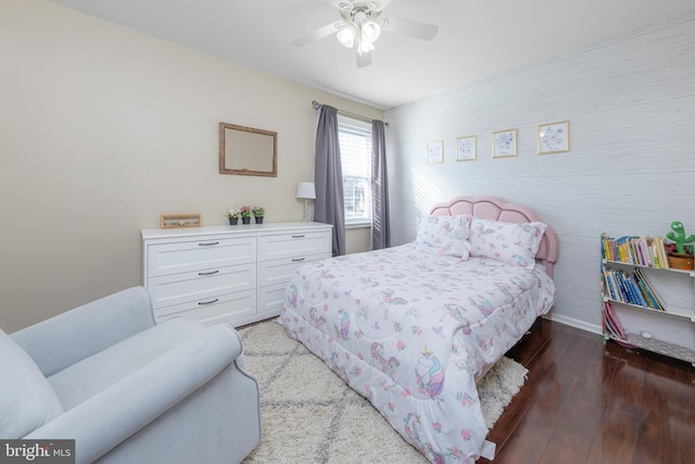 bedroom with ceiling fan and hardwood / wood-style floors