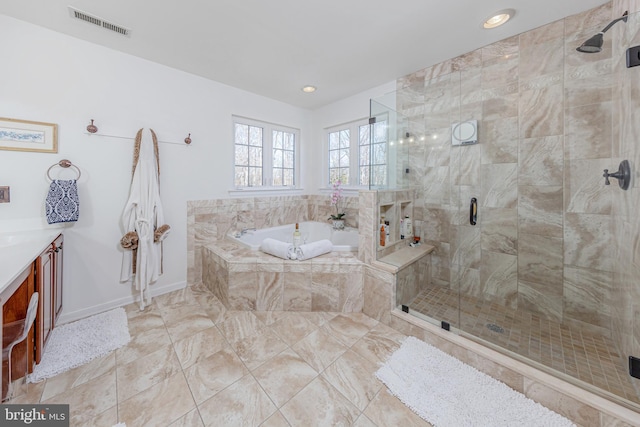 bathroom featuring vanity and plus walk in shower