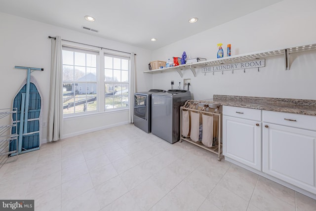 laundry area with cabinets and independent washer and dryer