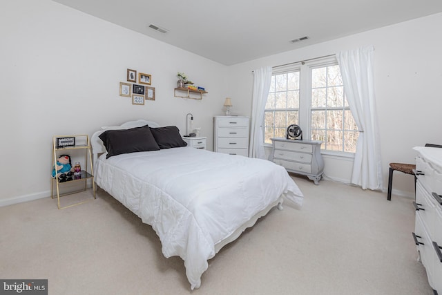 bedroom with light carpet