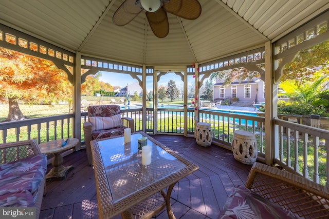 wooden terrace featuring a gazebo