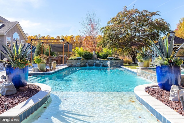 view of swimming pool featuring an outdoor bar, pool water feature, and a pergola