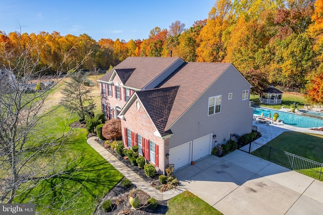 view of home's exterior with a yard and a garage